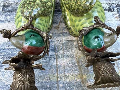 Pair of green porcelain wall sconces in the form of Parrots