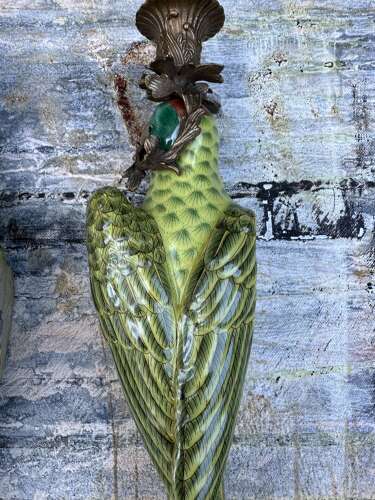 Pair of green porcelain wall sconces in the form of Parrots