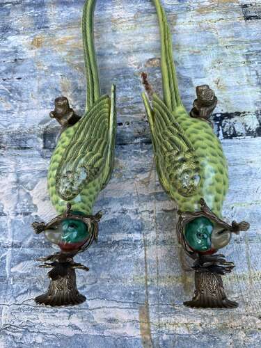 Pair of green porcelain wall sconces in the form of Parrots