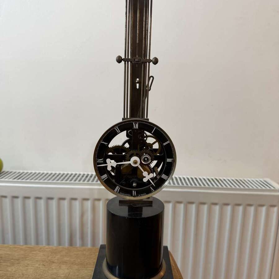 French Style Mystery Pinwheel Upside Down Skeleton Swinging Clock