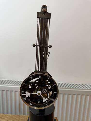 French Style Mystery Pinwheel Upside Down Skeleton Swinging Clock